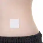 Image of an ACCESS CBD Dermal Patch applied on a person's back, illustrating ease of use and comfort.